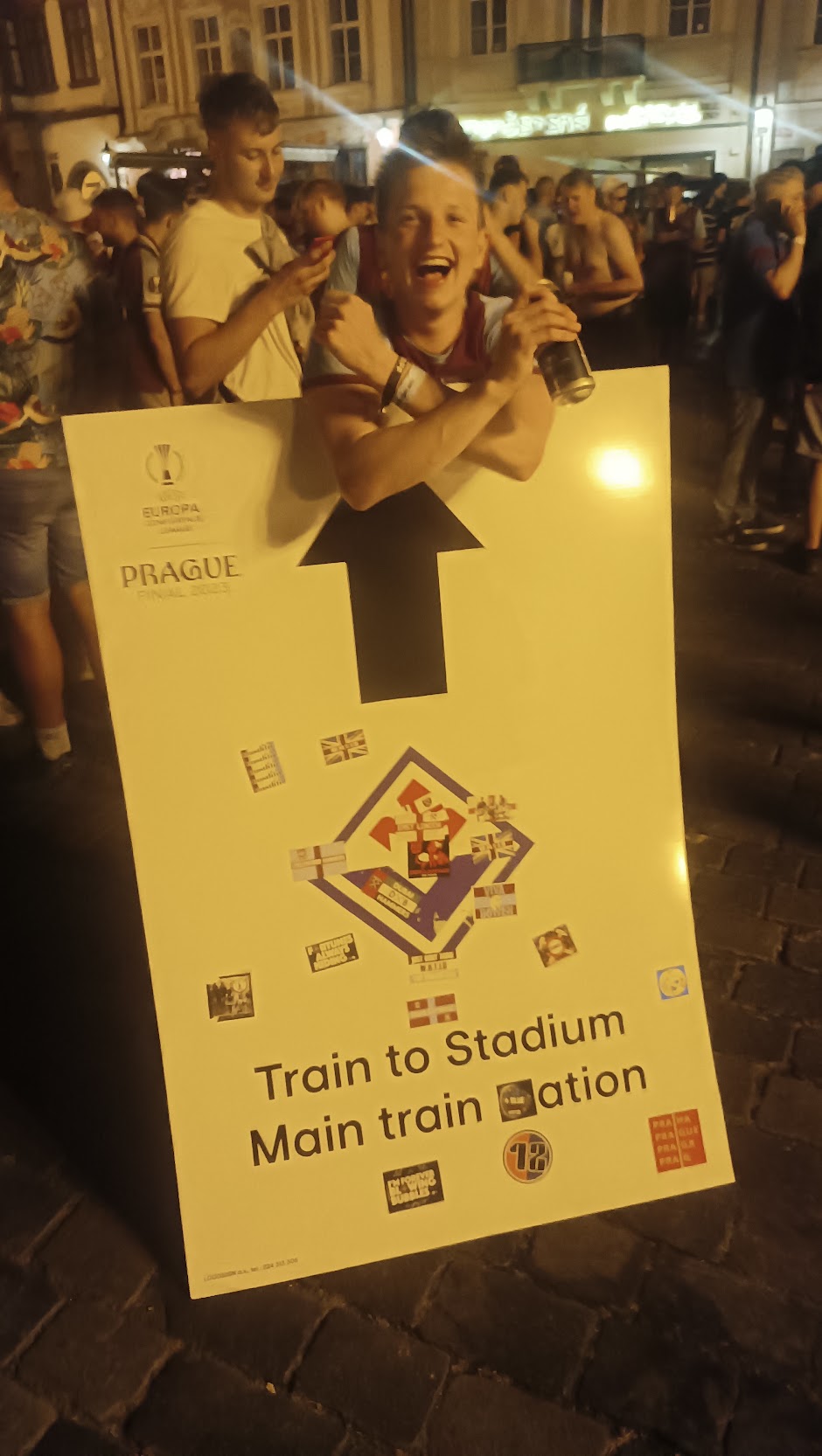 Behind a Train to Stadium sign in Prague